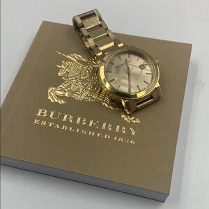 Women’s Burberry Gold Watch.